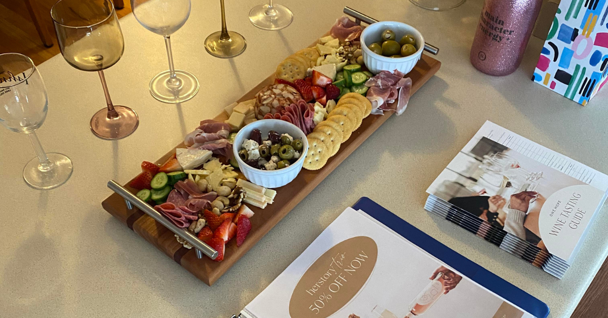 charcuterie board and wine glasses